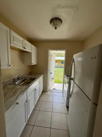 a bathroom with a sink a toilet and tub