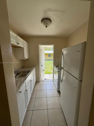 a view of a bathroom from a hallway