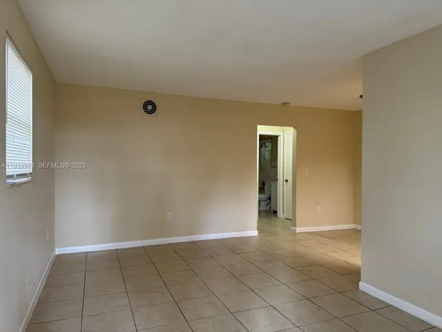 a view of an empty room and window