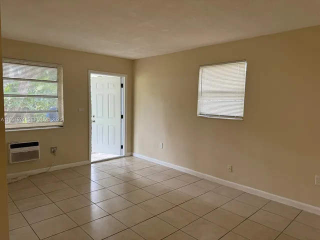 a view of an empty room and window