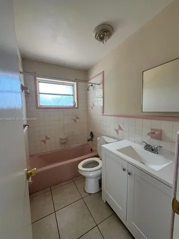 a kitchen with stainless steel appliances granite countertop a sink and a stove