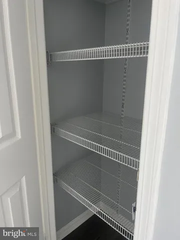 a view of kitchen with stainless steel appliances a refrigerator and a stove