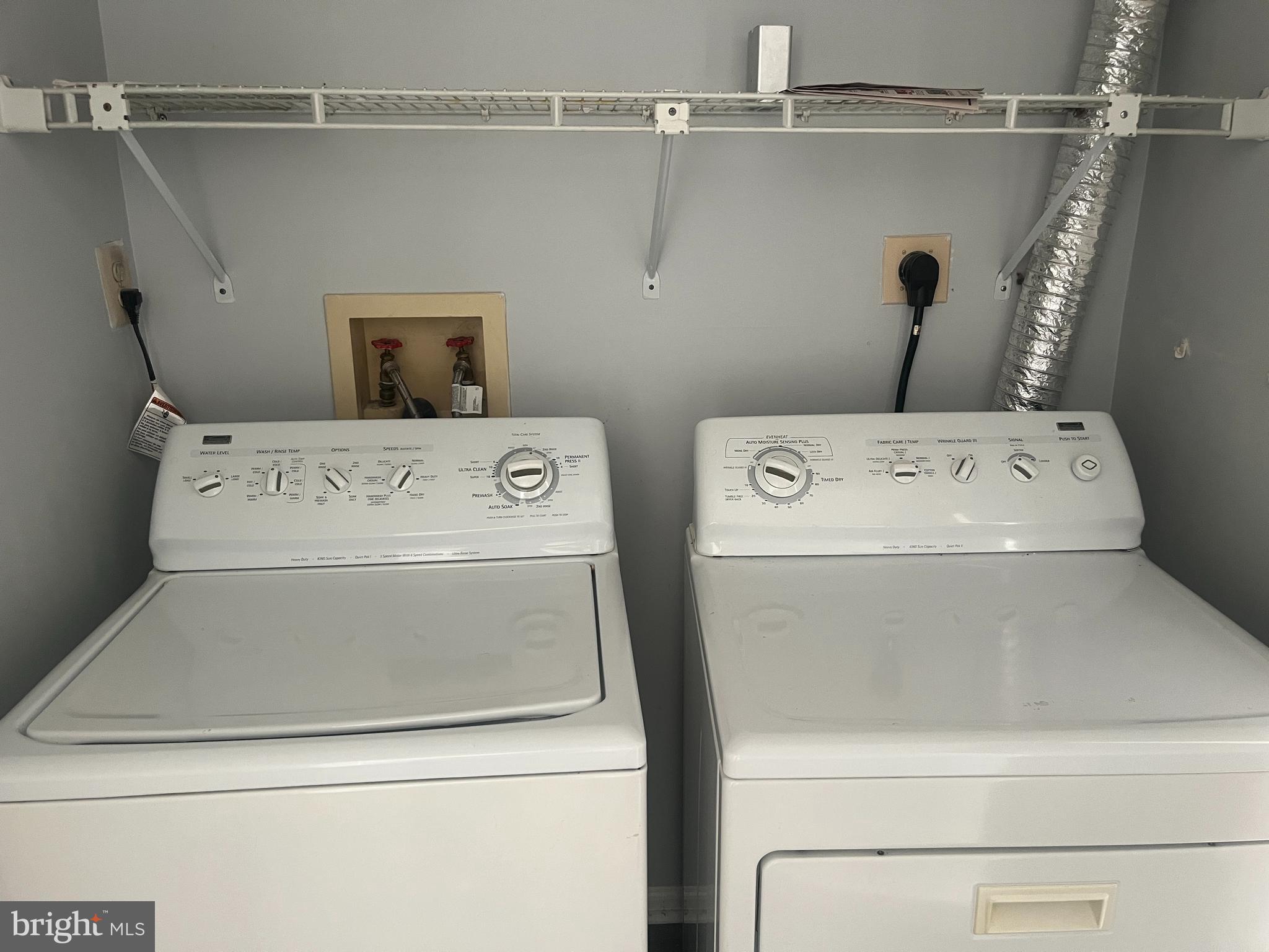 11510 Little Patuxent Parkway, Unit 407 Columbia, MD 21044 - Photo 15 of 15 a utility room with dryer and washer