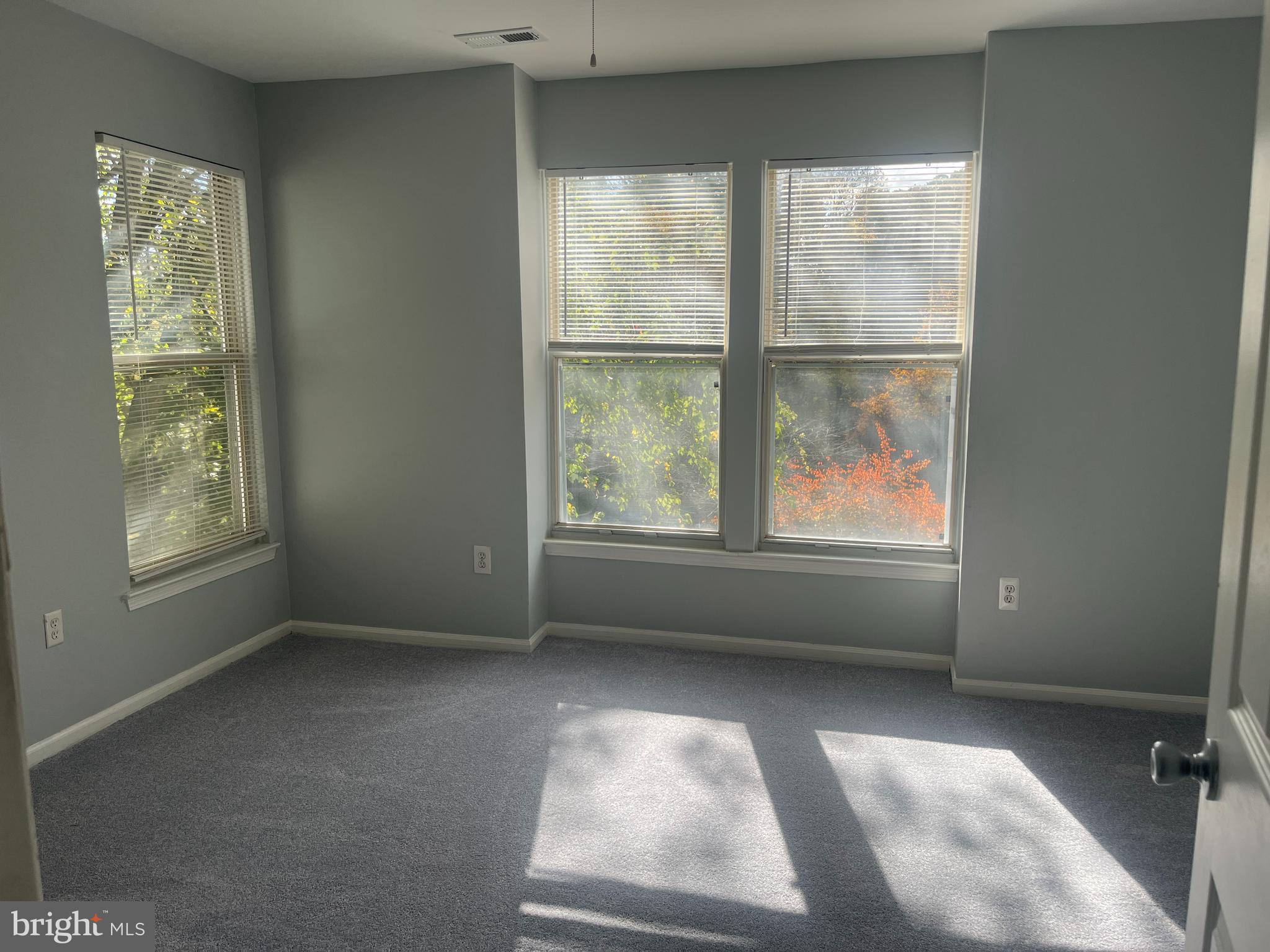 11510 Little Patuxent Parkway, Unit 407 Columbia, MD 21044 - Photo 6 of 15 an empty room with windows