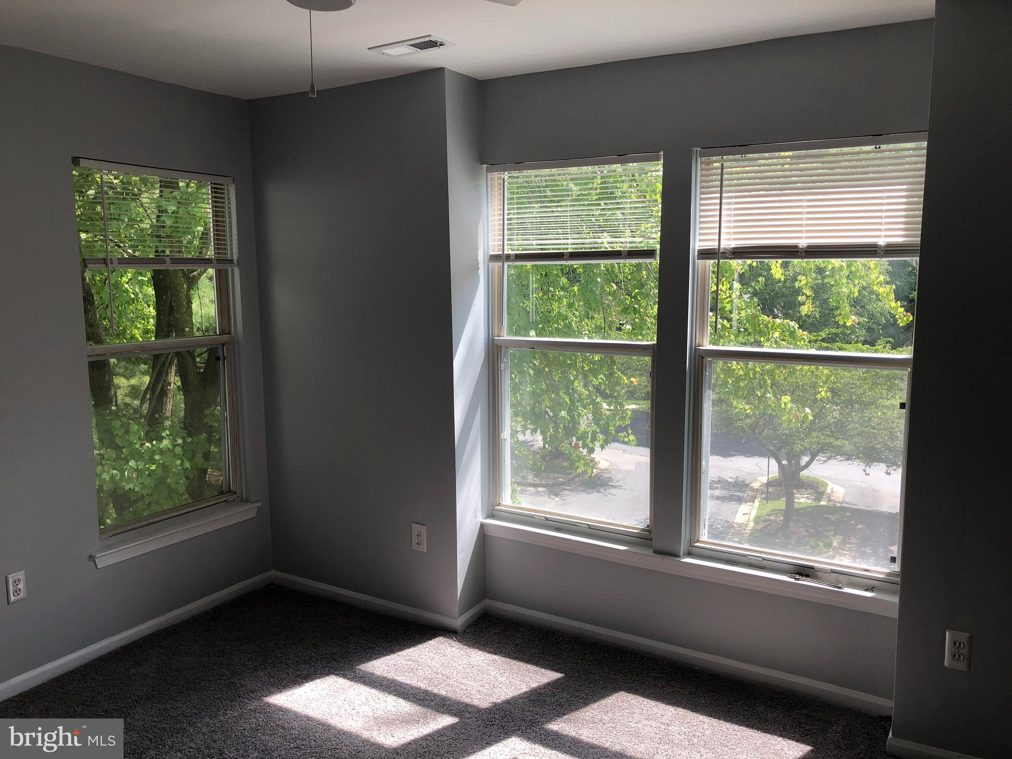 11510 Little Patuxent Parkway, Unit 407 Columbia, MD 21044 - Photo 7 of 15 a view of an empty room with a window