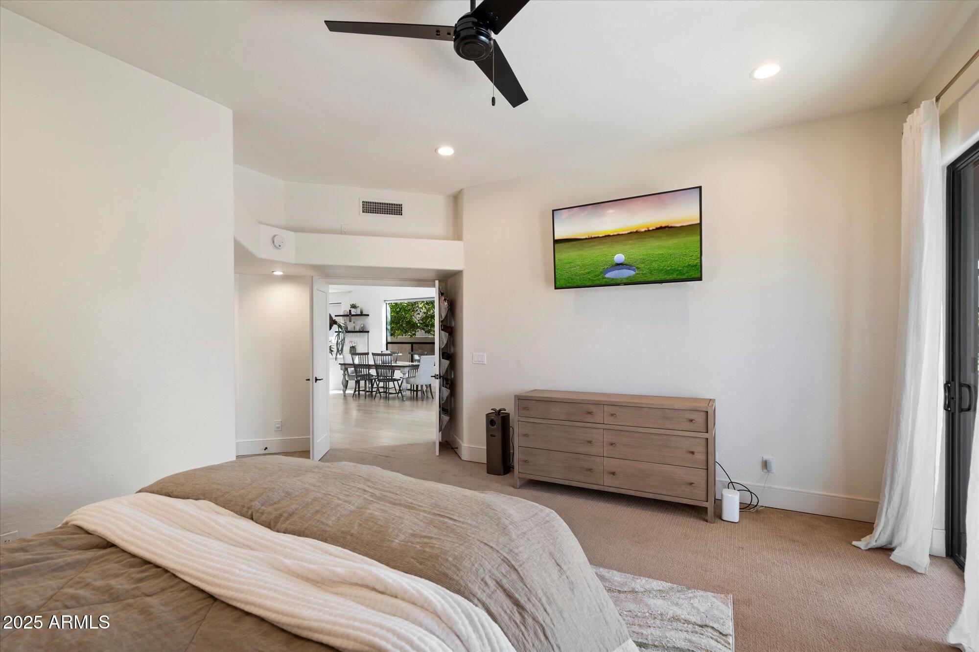 11846 North 40th Place Phoenix, AZ 85028 - Photo 15 of 37 a bedroom with a bed and a flat screen tv