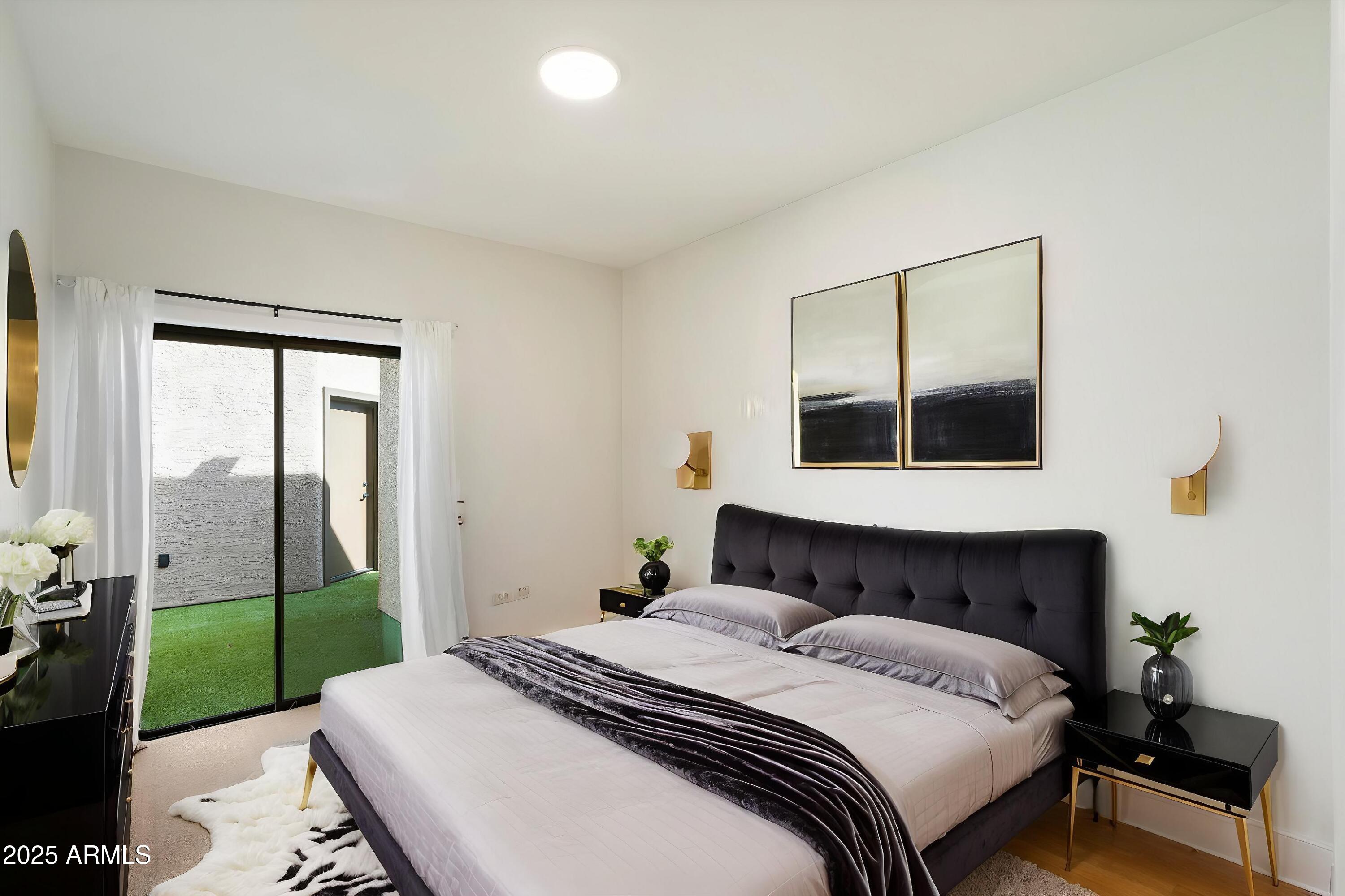 11846 North 40th Place Phoenix, AZ 85028 - Photo 19 of 37 a bedroom with a bed and a mirror