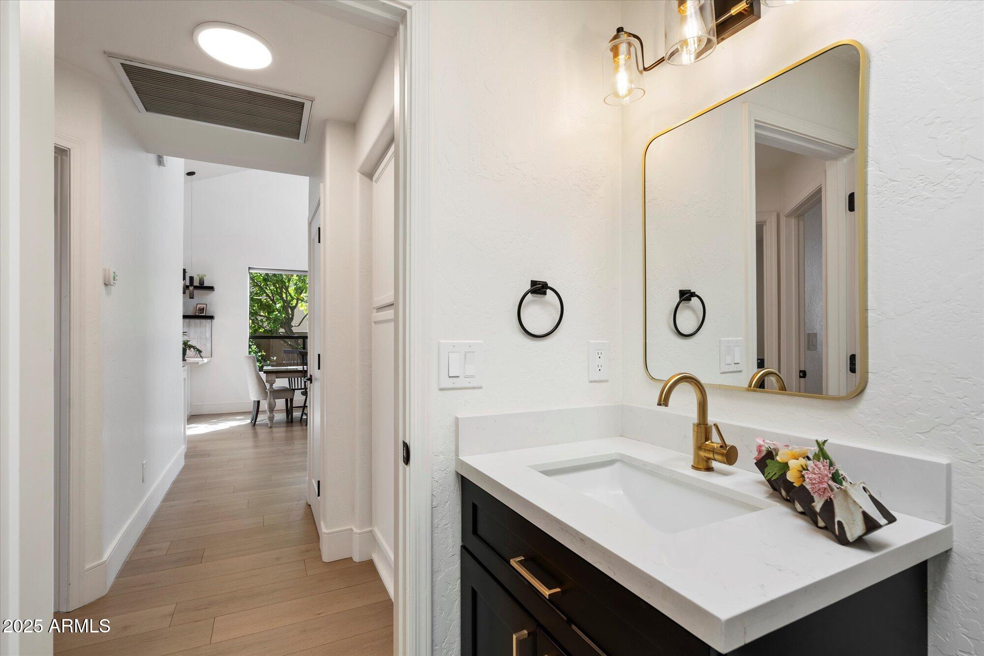 11846 North 40th Place Phoenix, AZ 85028 - Photo 22 of 37 a bathroom with a sink and a mirror