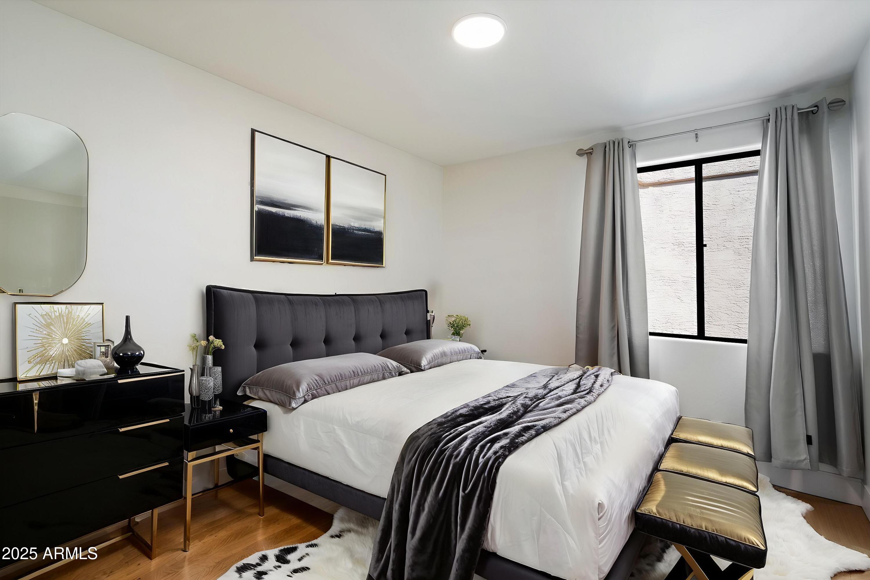 11846 North 40th Place Phoenix, AZ 85028 - Photo 23 of 37 a bedroom with a bed and a mirror