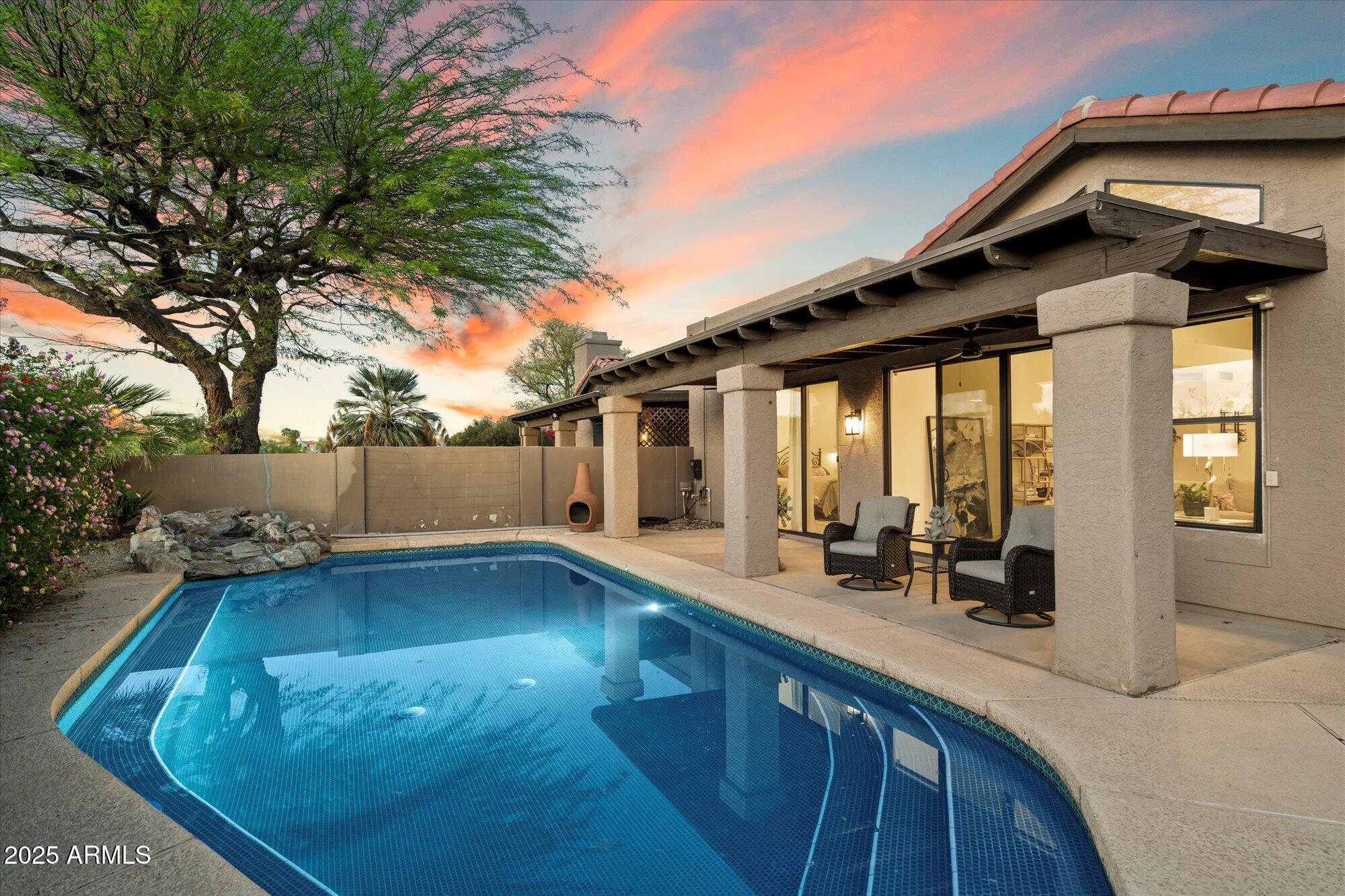 11846 North 40th Place Phoenix, AZ 85028 - Photo 27 of 37 a view of a house with backyard and sitting area