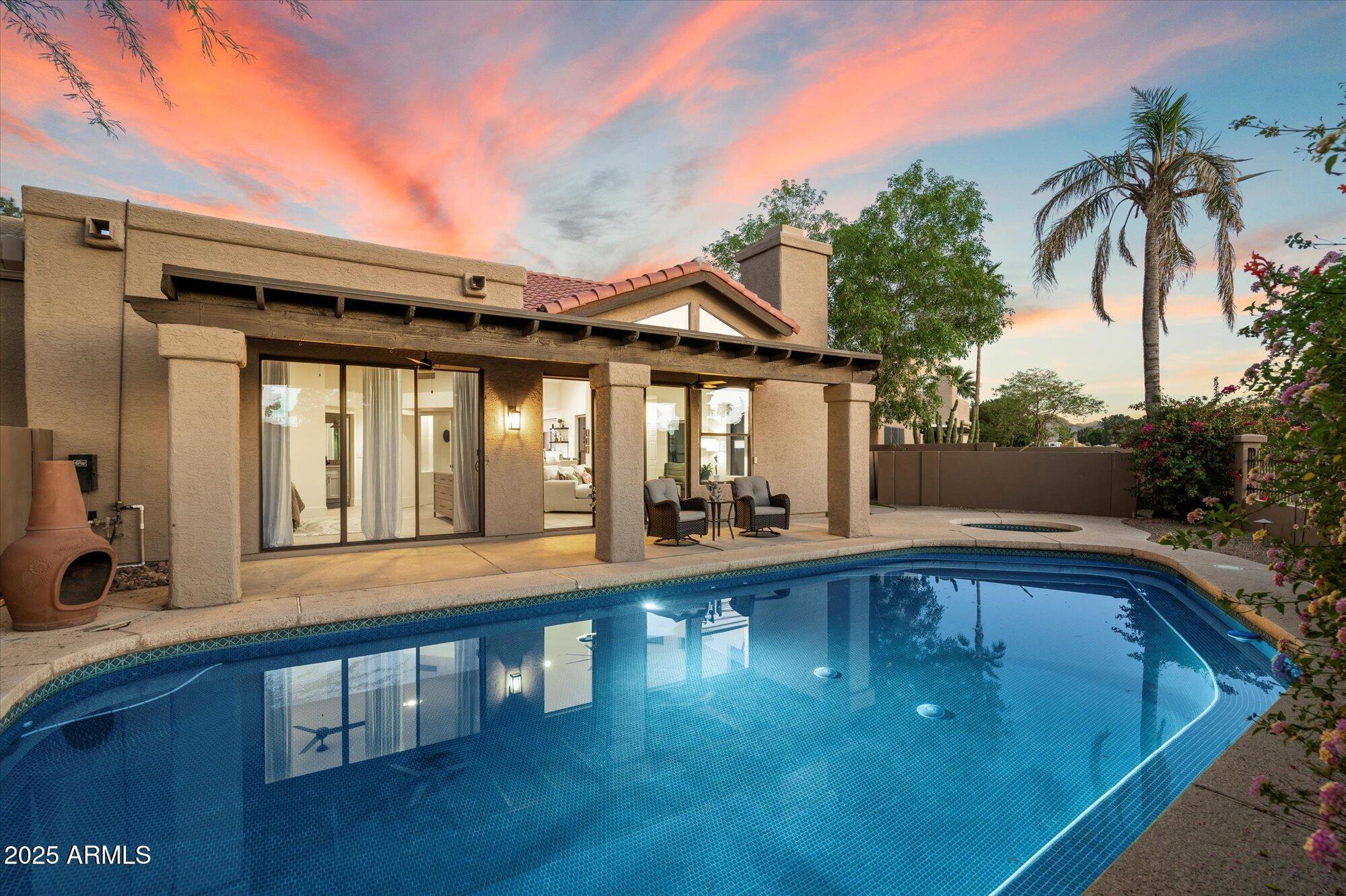 11846 North 40th Place Phoenix, AZ 85028 - Photo 28 of 37 a view of swimming pool with outdoor seating