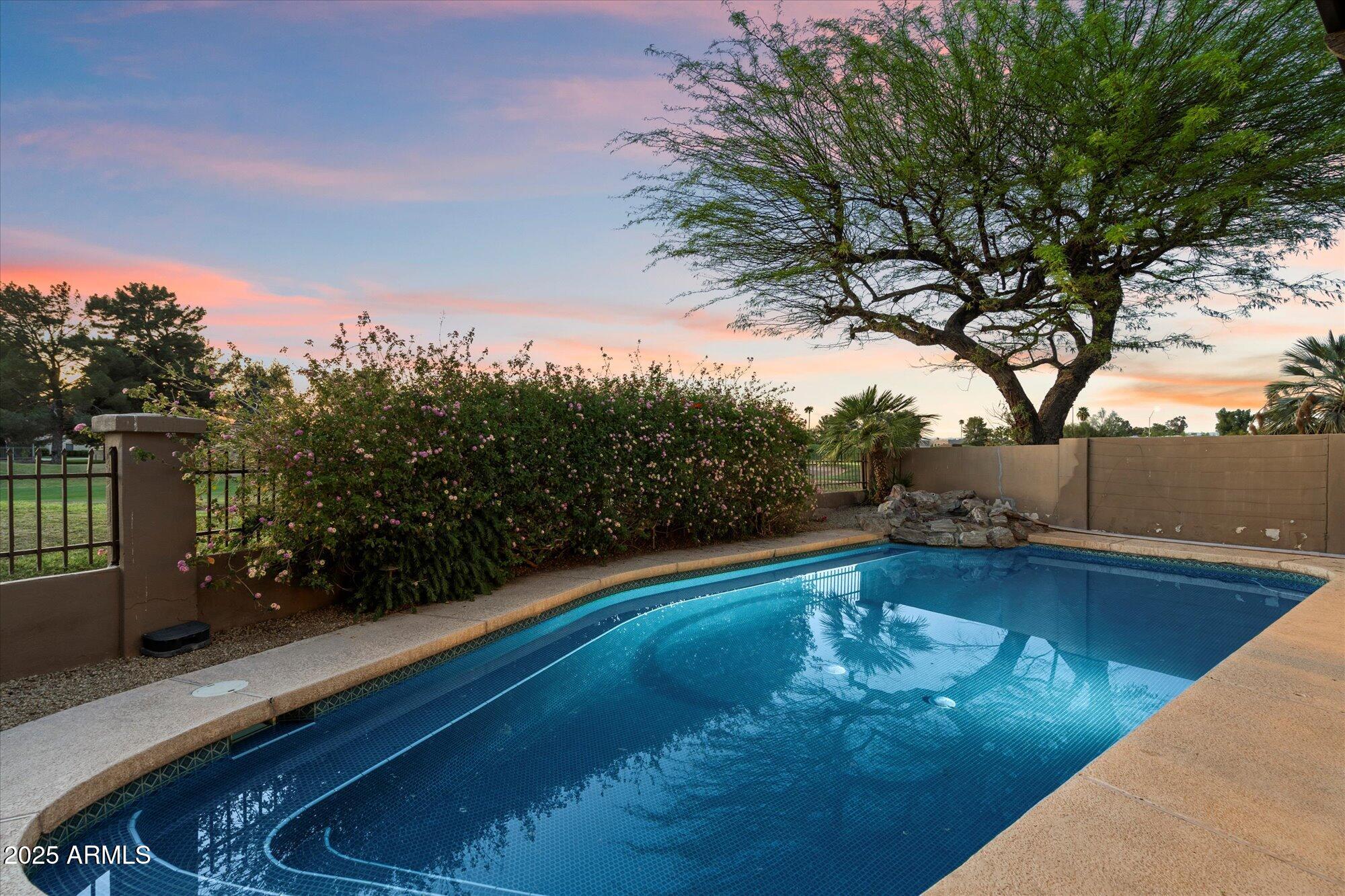 11846 North 40th Place Phoenix, AZ 85028 - Photo 30 of 37 a view of a swimming pool with a yard