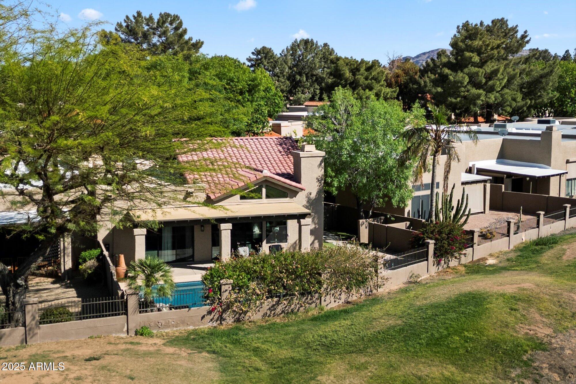 11846 North 40th Place Phoenix, AZ 85028 - Photo 35 of 37 a view of house with a yard