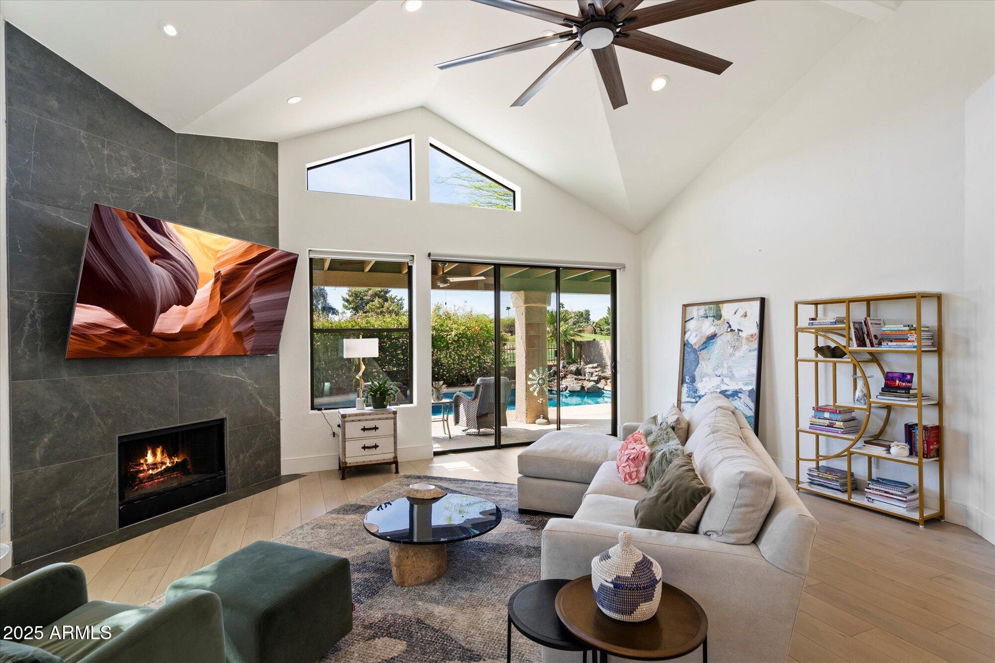 11846 North 40th Place Phoenix, AZ 85028 - Photo 4 of 37 a living room with furniture and a fireplace