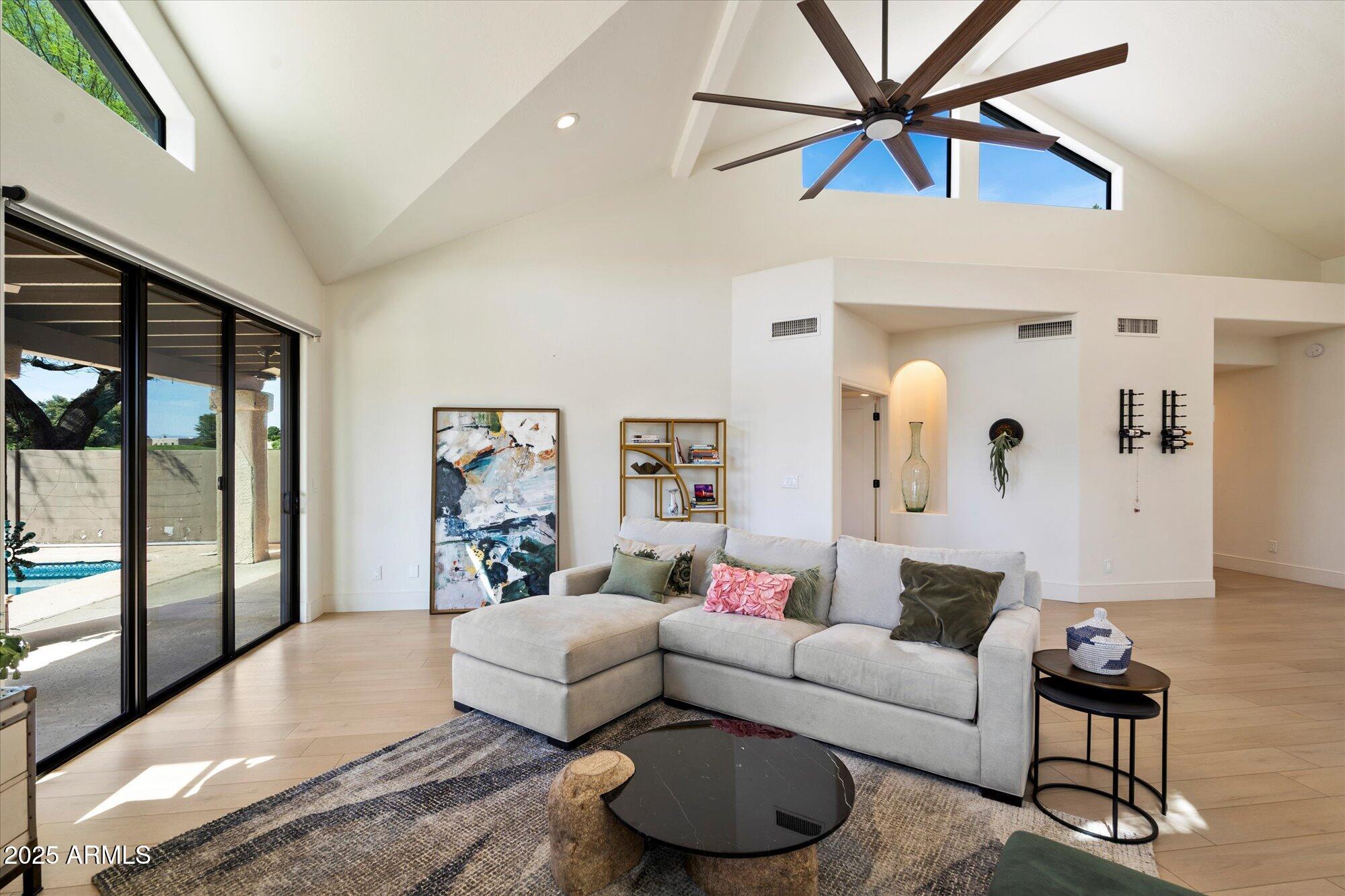 11846 North 40th Place Phoenix, AZ 85028 - Photo 7 of 37 a living room with furniture and a large window