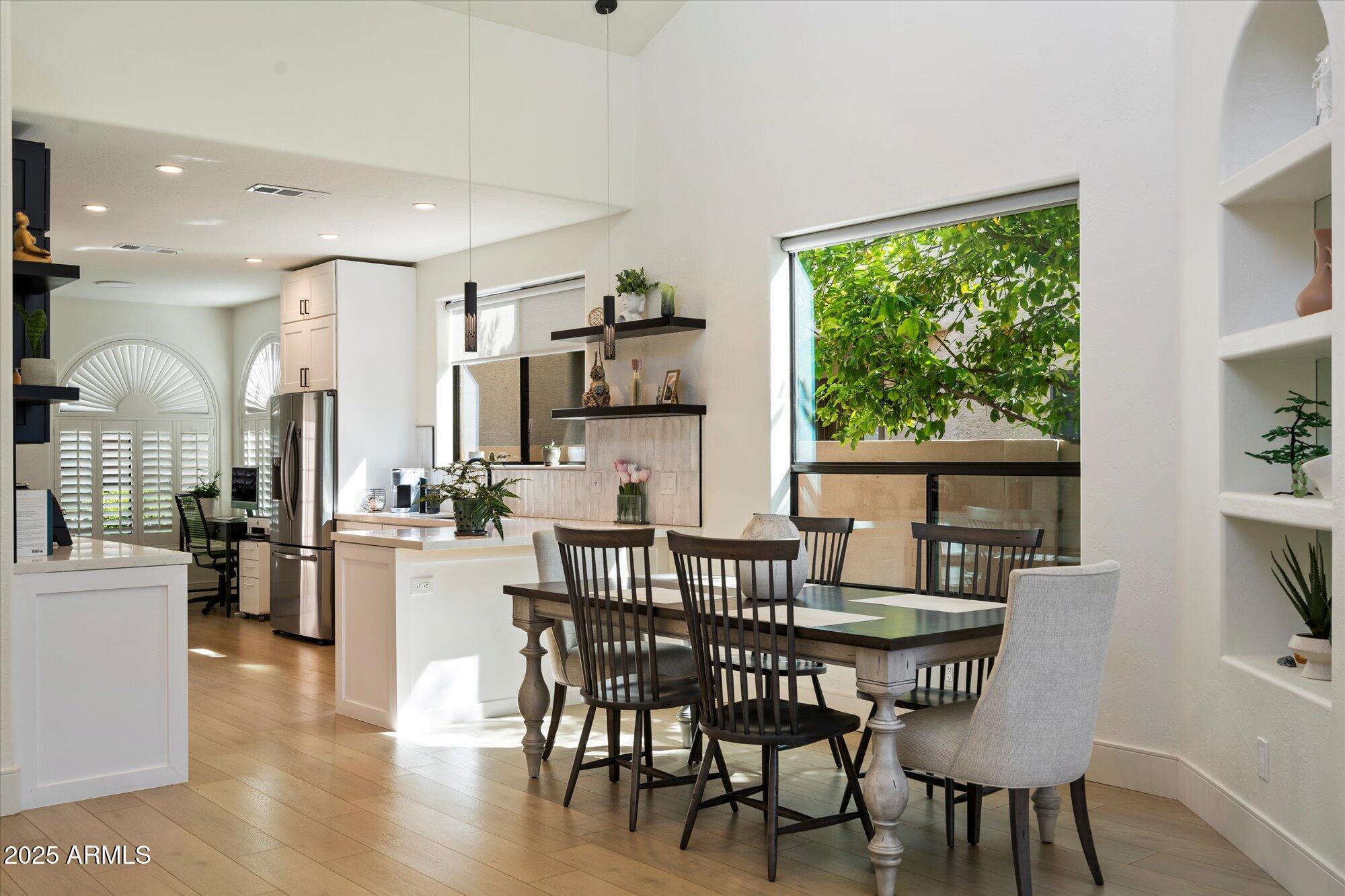 11846 North 40th Place Phoenix, AZ 85028 - Photo 8 of 37 a view of a dining room with furniture window and wooden floor