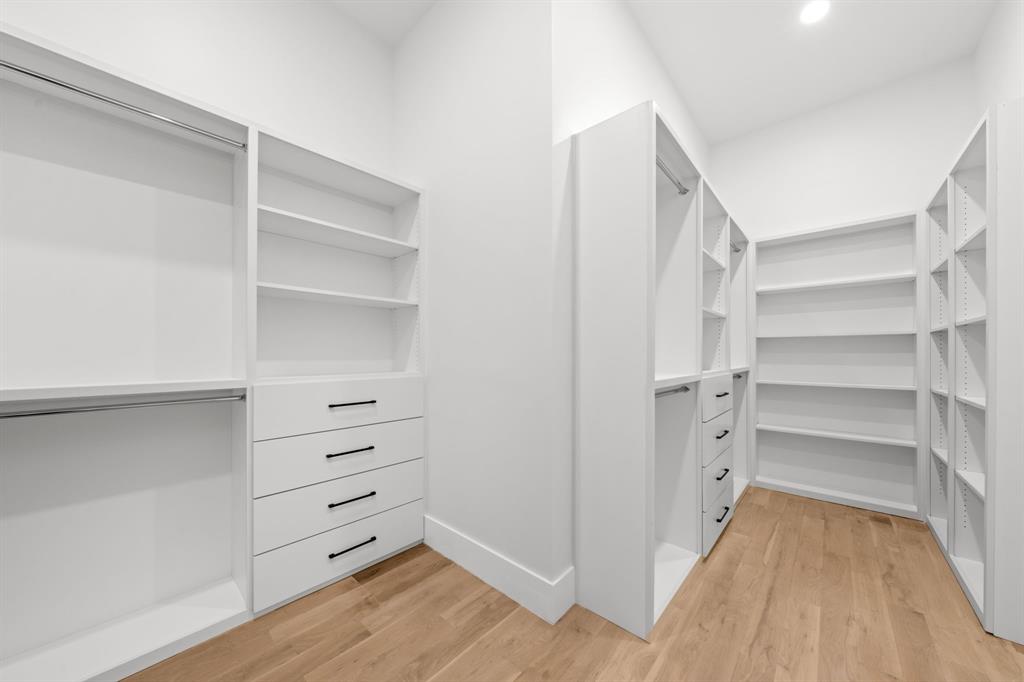 3115 Gibbs Williams Road Dallas, TX 75233 - Photo 13 of 29 a view of walk in closet with empty racks