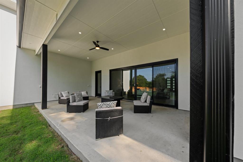 3115 Gibbs Williams Road Dallas, TX 75233 - Photo 24 of 29 a living room with furniture large window and flat screen tv
