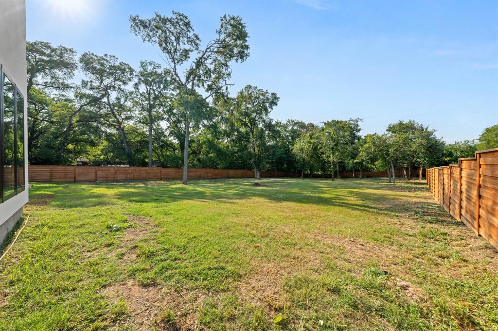 3115 Gibbs Williams Road Dallas, TX 75233 - Photo 25 of 29 a view of a swimming pool with a yard