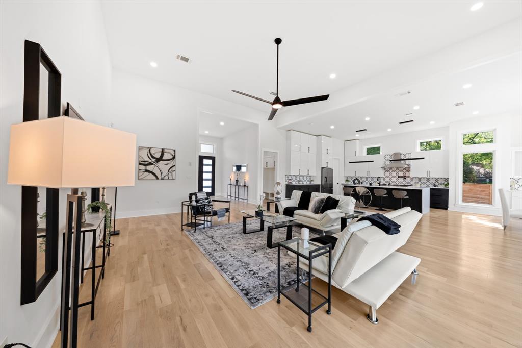 3115 Gibbs Williams Road Dallas, TX 75233 - Photo 6 of 29 a living room with lots of furniture and a chandelier