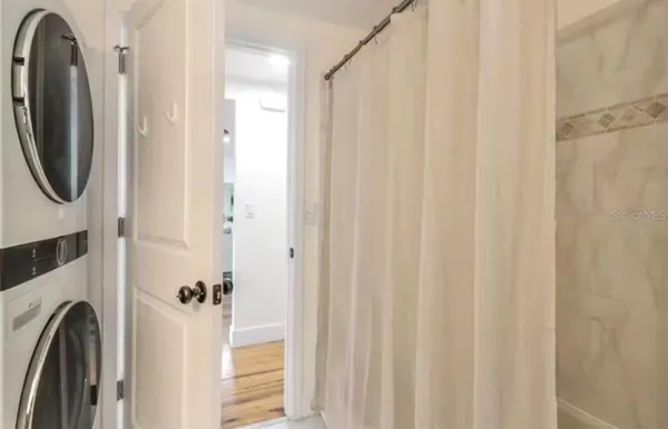 a view of a bathroom with a washer and dryer