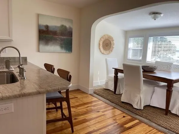 a dining room with table and chairs