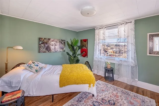 a bedroom with a bed and a table in it