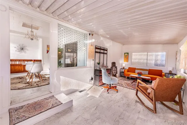 a living room with furniture or couch and a dining table