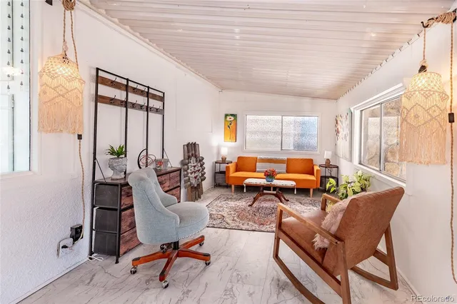 a living room with furniture or couch and a window