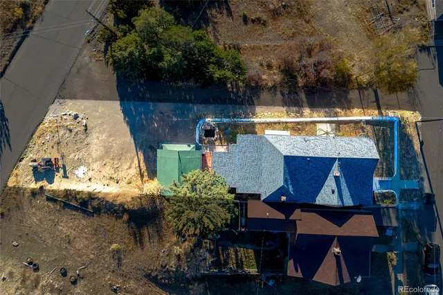 an aerial view of a house with swimming pool