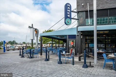 a view of a patio with table and chairs potted plants