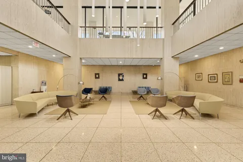 a front view of a building with trees