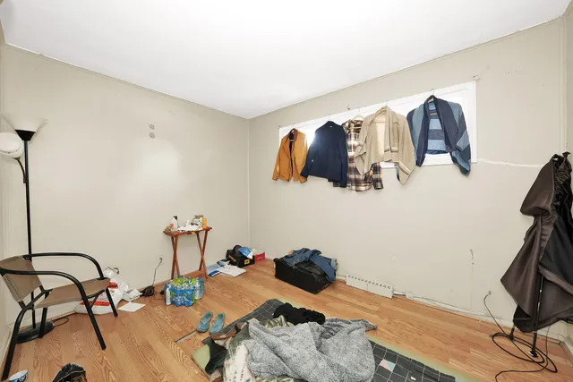 a bedroom with a bed and cabinets