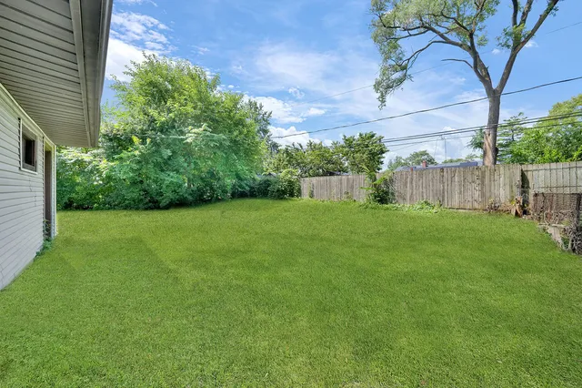 a view of a backyard with a garden