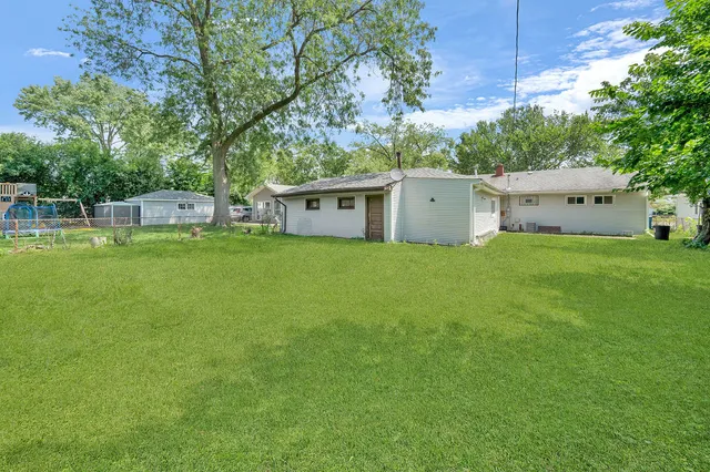 a view of a house with a big yard