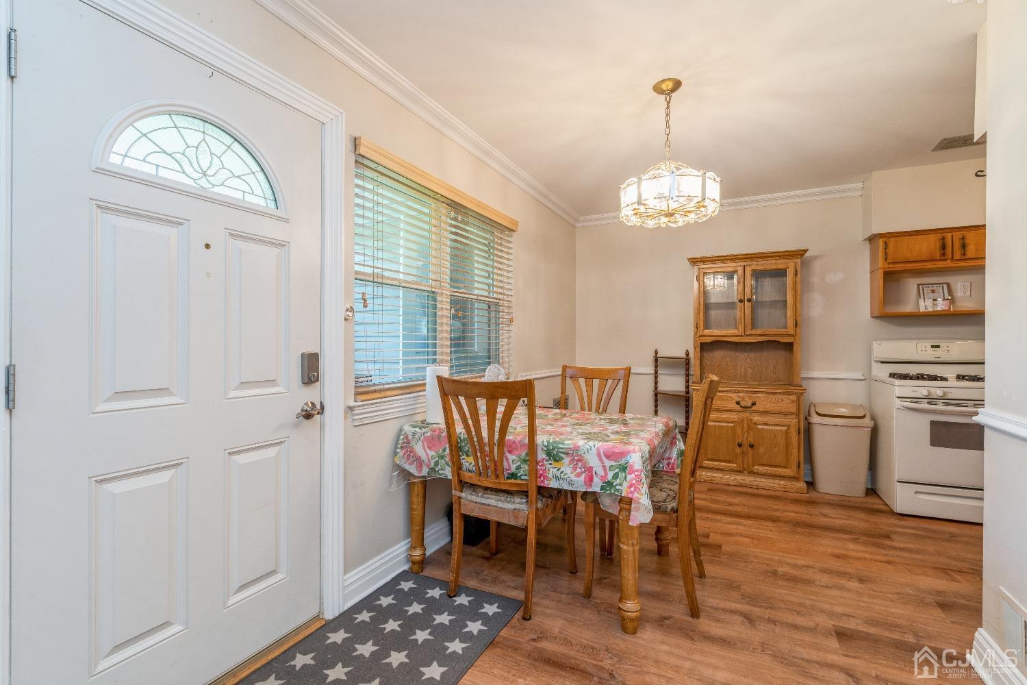 39 Haven Drive Old Bridge, NJ 07747 - Photo 11 of 16 a view of a dining room with furniture window and wooden floor