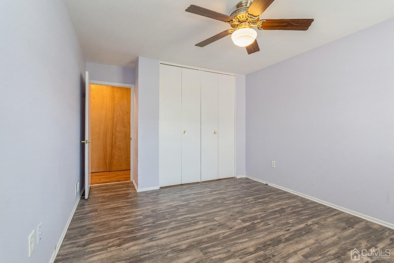 39 Haven Drive Old Bridge, NJ 07747 - Photo 13 of 16 an empty room with closet and a chandelier fan