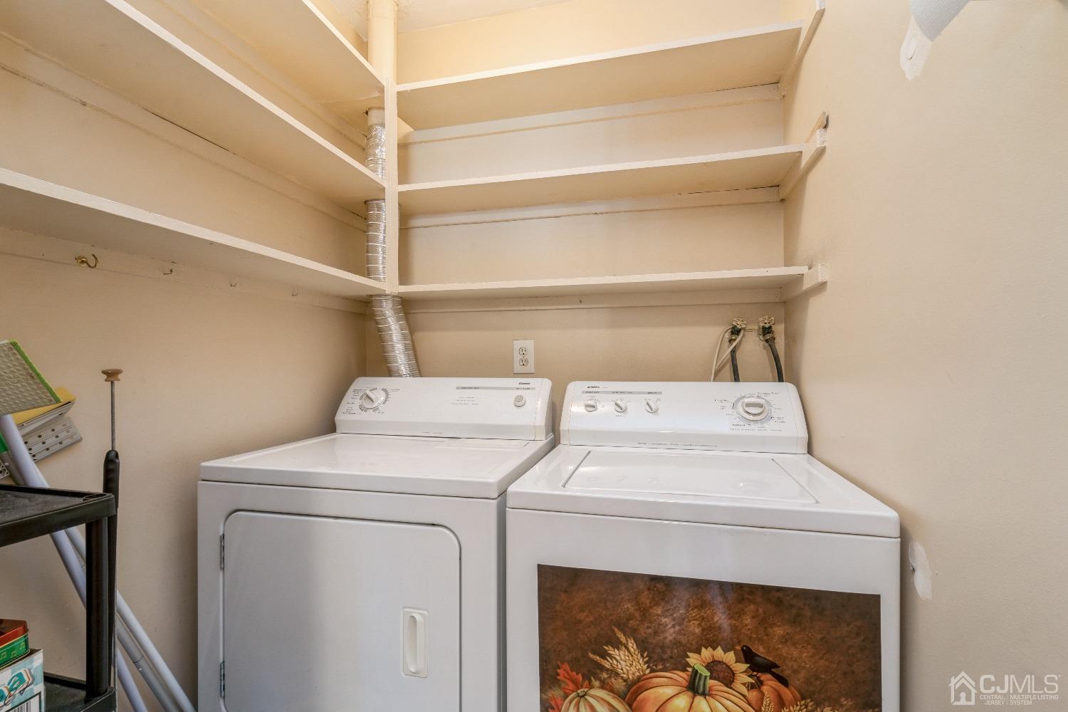 39 Haven Drive Old Bridge, NJ 07747 - Photo 16 of 16 a utility room with dryer and washer