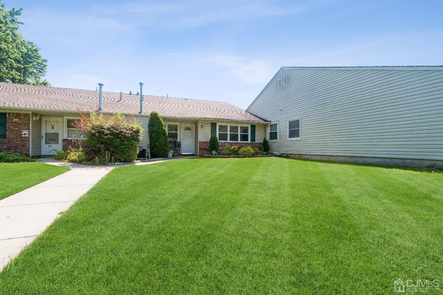 39 Haven Drive Old Bridge, NJ 07747 - Photo 2 of 16 a front view of a house with a yard