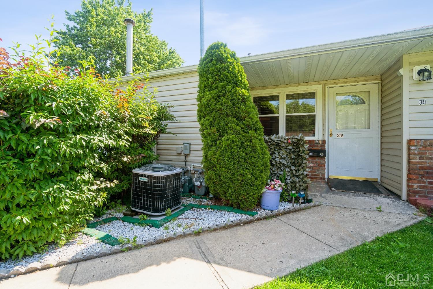 39 Haven Drive Old Bridge, NJ 07747 - Photo 3 of 16 a front view of a house having yard