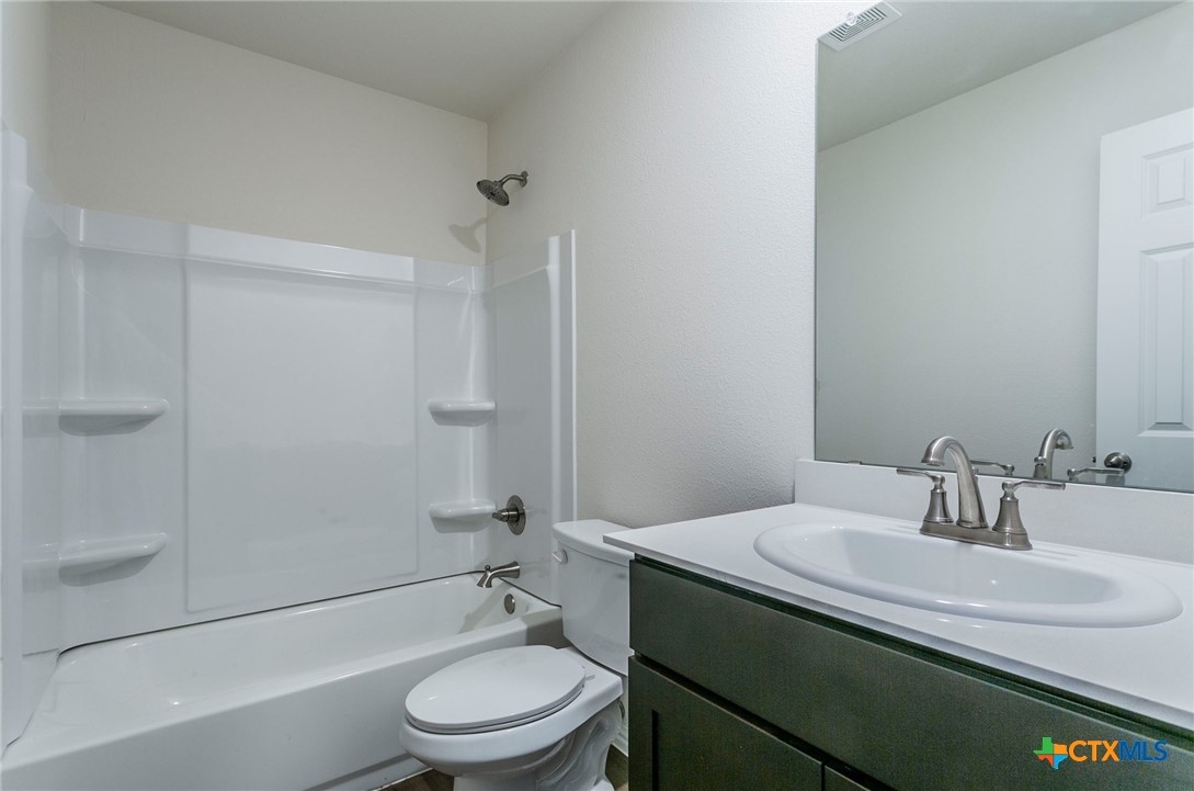 3009 Gillespie Court Temple, TX 76501 - Photo 11 of 13 a bathroom with a sink toilet and shower