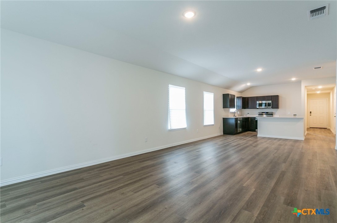 3009 Gillespie Court Temple, TX 76501 - Photo 3 of 13 a view of a kitchen with a sink and a stove top oven