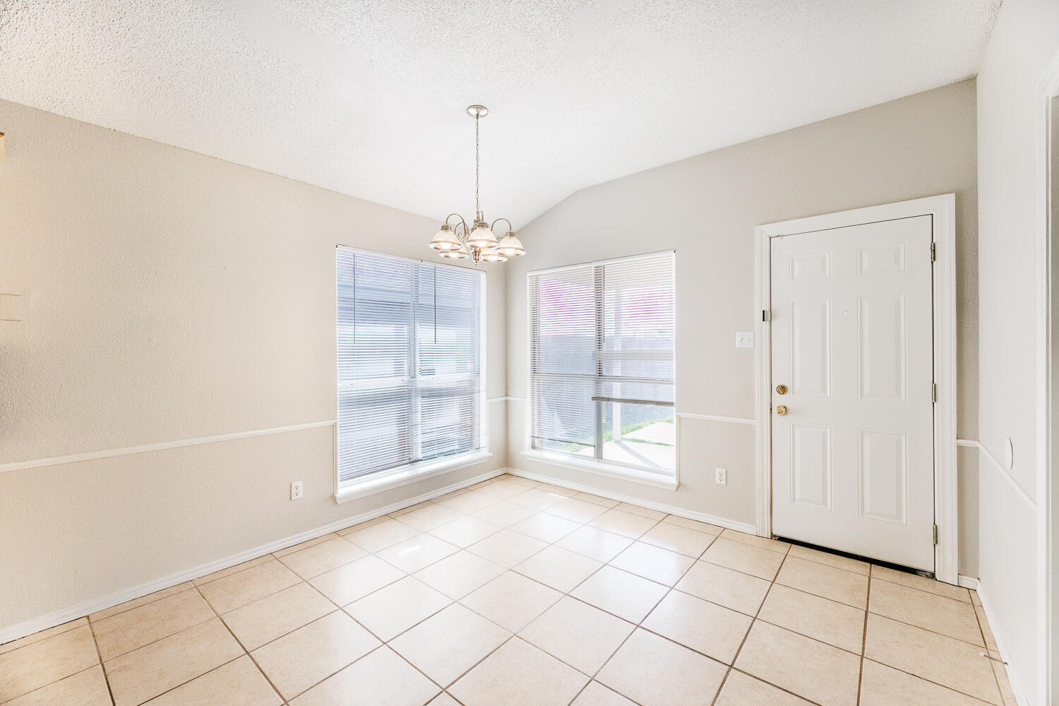 5903 10th Street, Unit 3 Lubbock, TX 79416 - Photo 12 of 32 a view of an empty room with a window