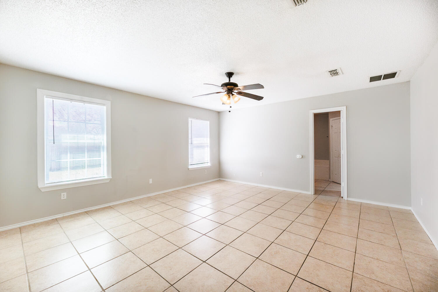 5903 10th Street, Unit 3 Lubbock, TX 79416 - Photo 18 of 32 a view of an empty room with a window