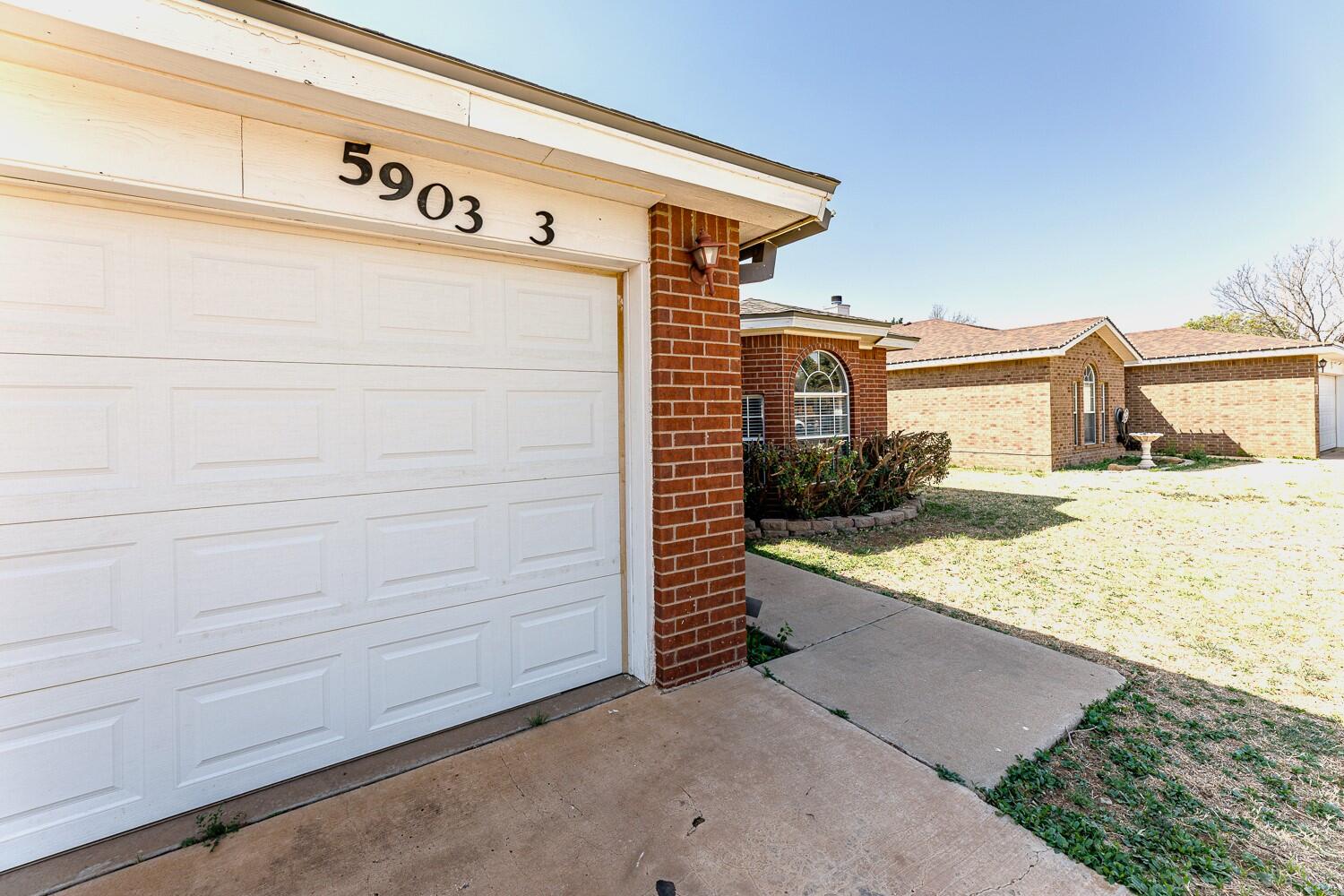 5903 10th Street, Unit 3 Lubbock, TX 79416 - Photo 2 of 32 a view of a house with garage