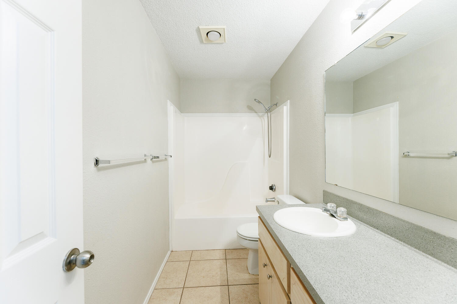 5903 10th Street, Unit 3 Lubbock, TX 79416 - Photo 25 of 32 a bathroom with a sink and a mirror