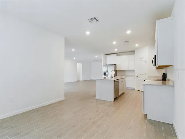 a large kitchen with a lot of counter top space