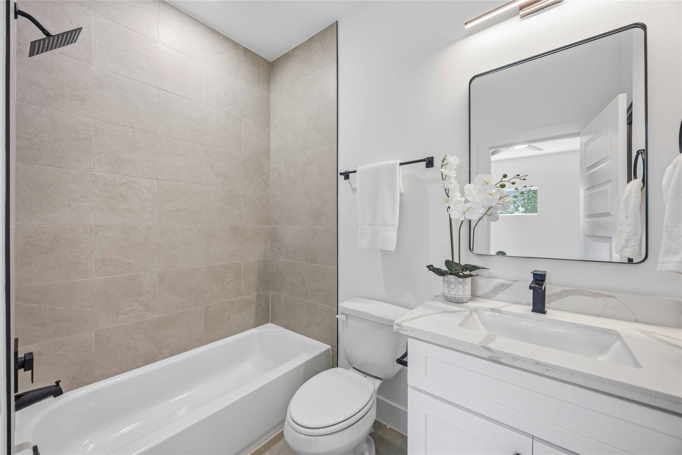 3103 Lelia Street, Unit A Houston, TX 77026 - Photo 16 of 30 a bathroom with a sink toilet and shower