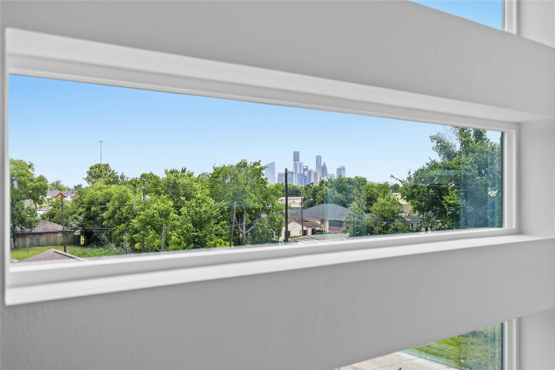 3103 Lelia Street, Unit A Houston, TX 77026 - Photo 24 of 30 a view of a window and a tree in front of a window