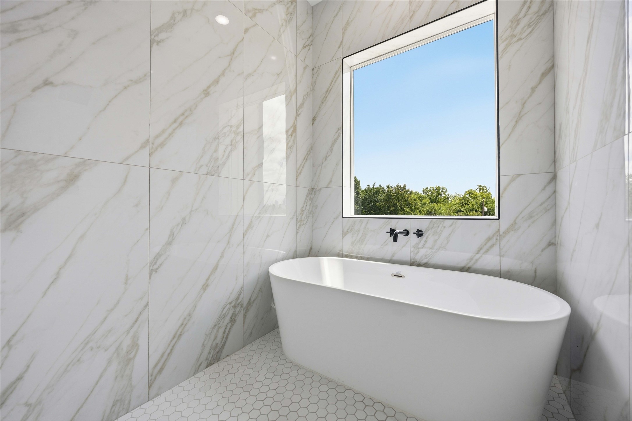 3103 Lelia Street, Unit A Houston, TX 77026 - Photo 27 of 30 a bathroom with a bathtub and shower